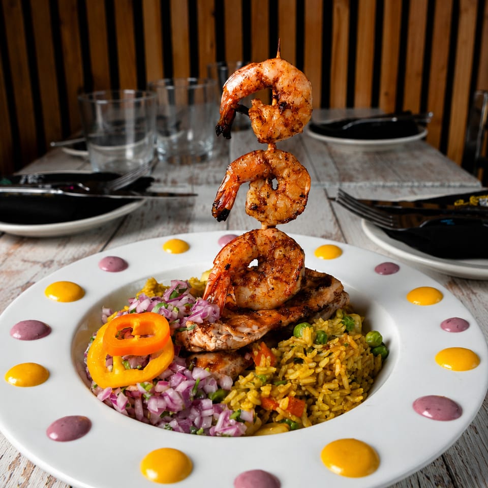Grilled shrimp skewer over chicken, yellow rice, and red onion relish on a white plate.